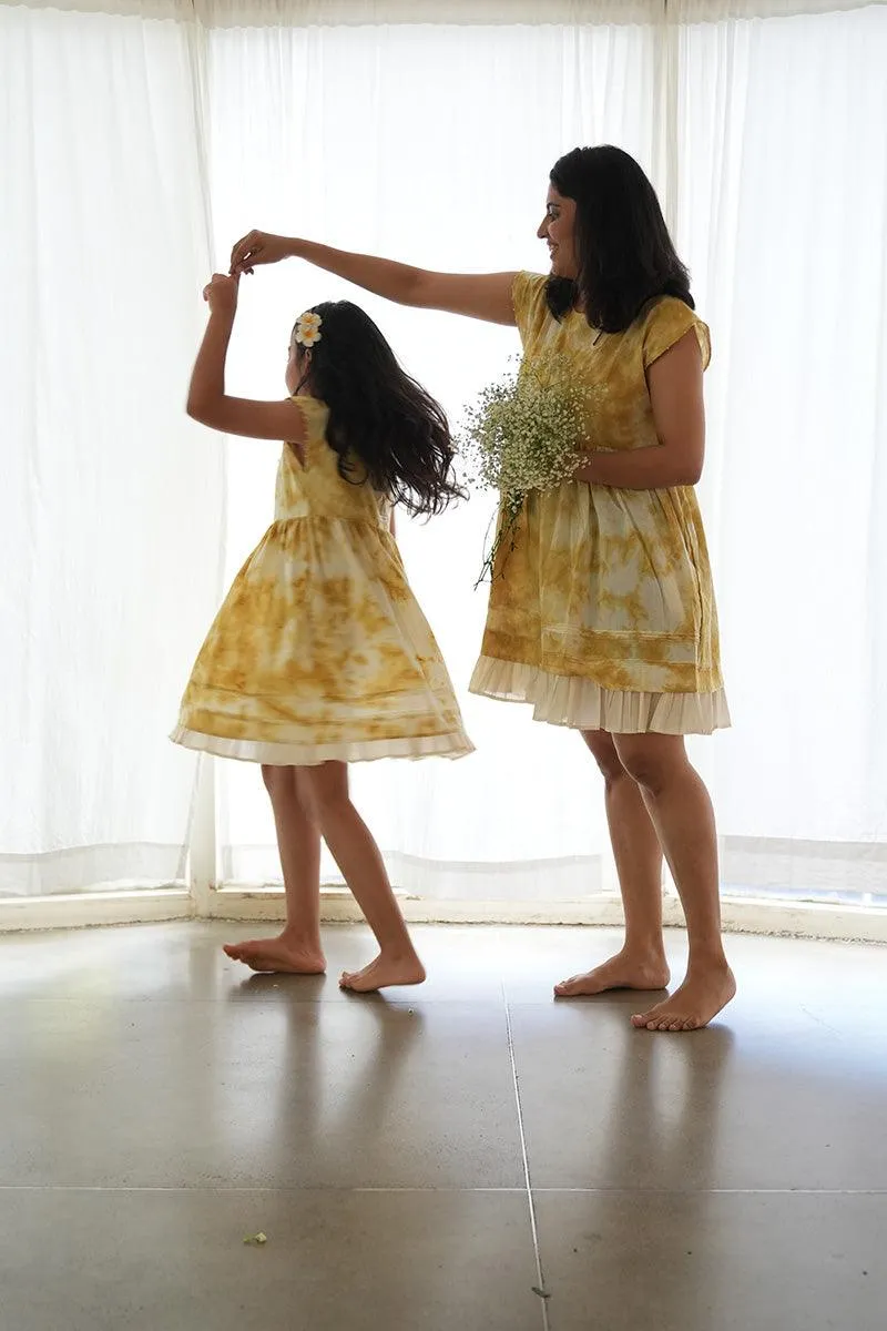 Turmeric Hues’ girls dress in ochre yellow hand tie dye