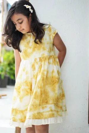 Turmeric Hues’ girls dress in ochre yellow hand tie dye